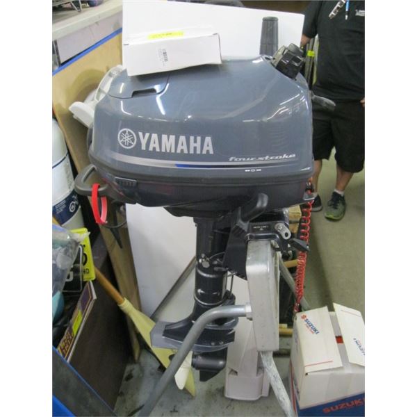 FOUR STROKE YAMAHA BOAT MOTOR WITH NEW PROP AND SPARE PROP