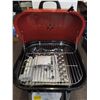 Image 2 : RED BBQ WITH NEW BAG OF BRIQUETTES