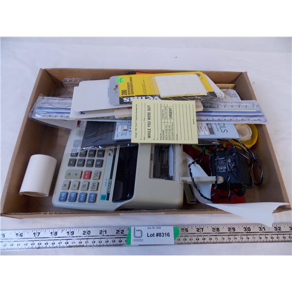 box of assorted stationery with adding machine