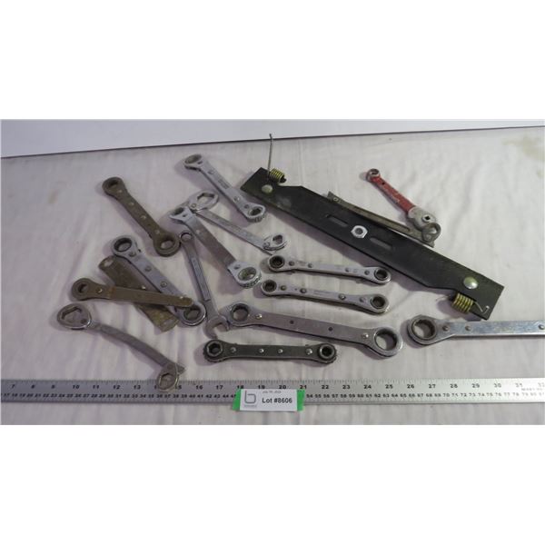 Box of various wrenches and mower blade