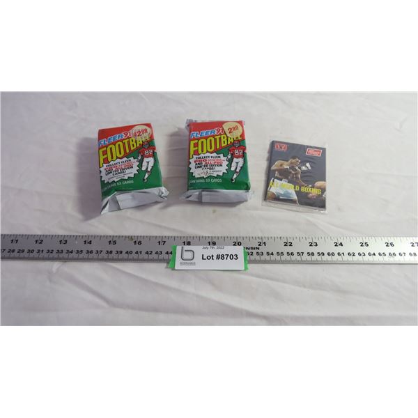(2) Pkgs Fleer Football Cards, (1) pkg Boxing Cards