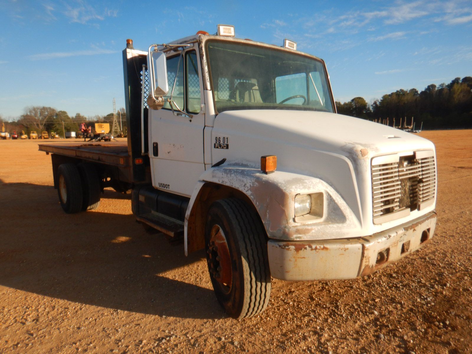 1996 FREIGHTLINER FL70 Flatbed Truck - J.M. Wood Auction Company, Inc.
