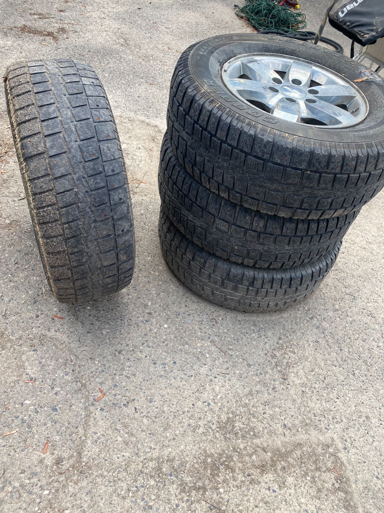 Tires on rims on rim damaged see pictures studded