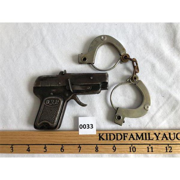 LOT OF 2 - METAL CAP GUN AND HANDCUFFS 