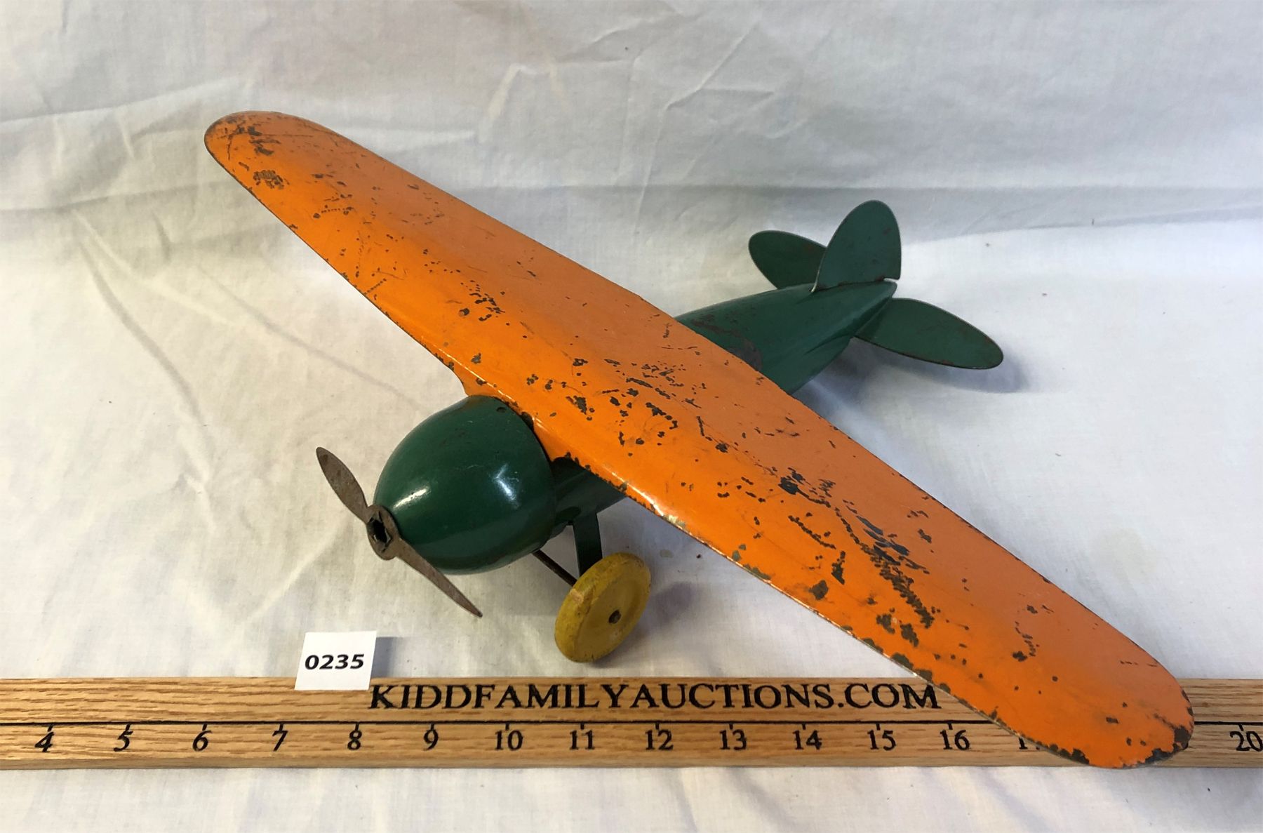 WYANDOTTE PRESSED STEEL AIRPLANE W/ WOOD WHEELS Kidd Family Auctions