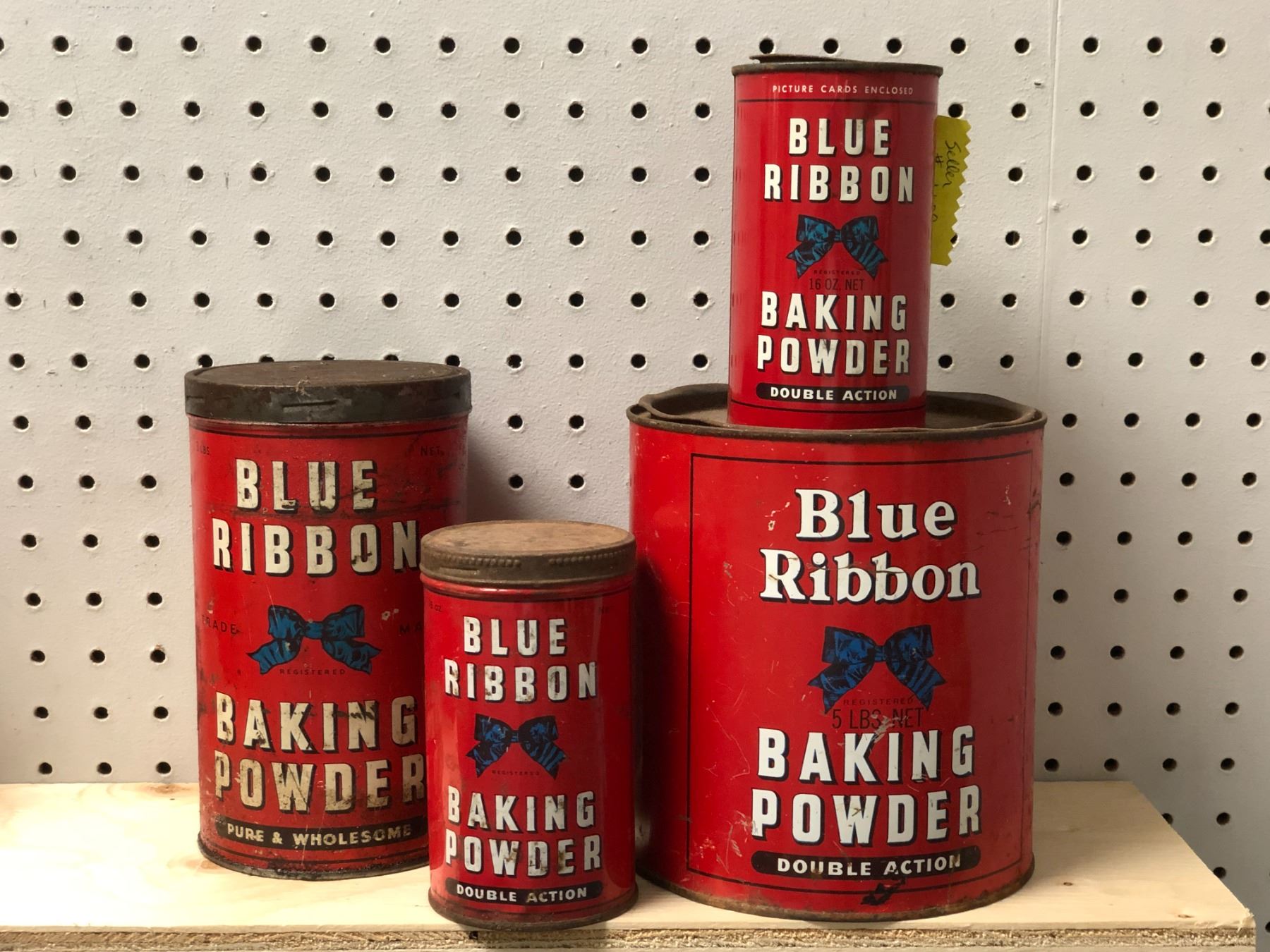 Group of 4 early 1900s Blue Ribbon baking powder collectors' tins
