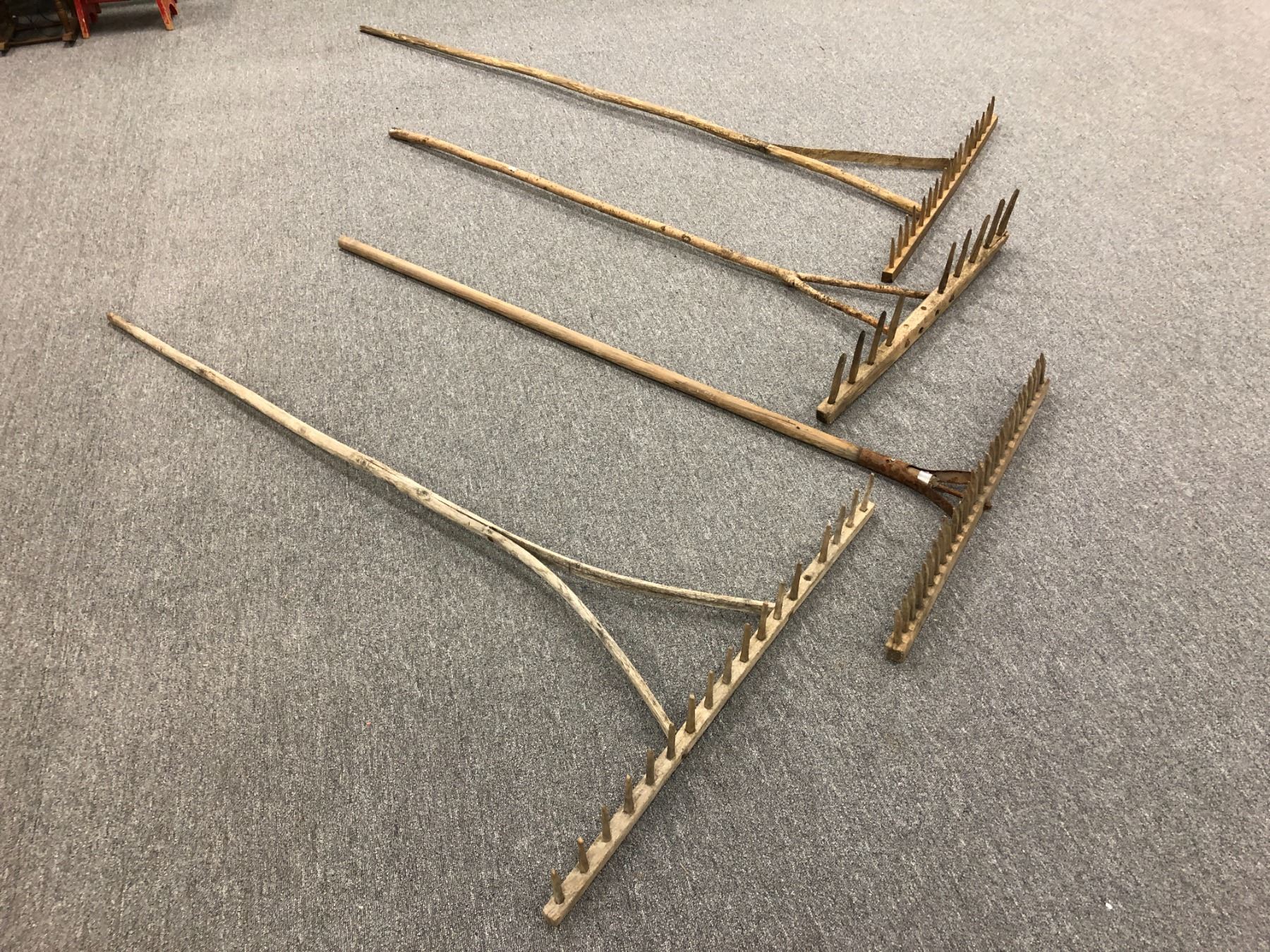 Group of 4 rustic wooden handmade hay rakes