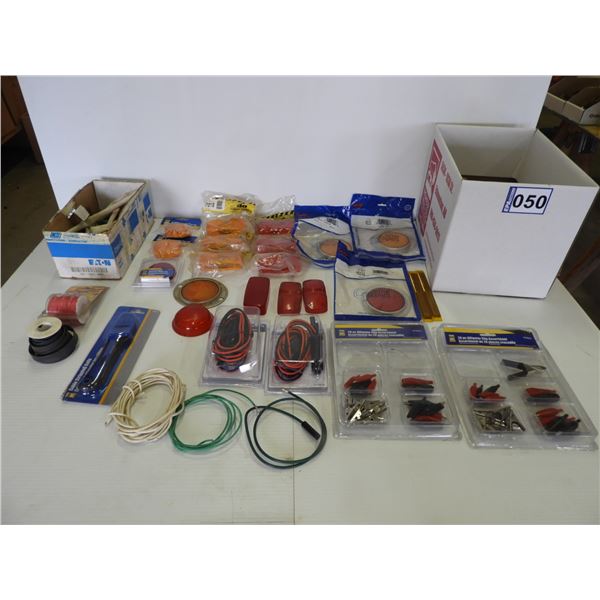 Assorted amber and red lens covers, amber and red reflectors, wire stripping knife, 12 V switches, a