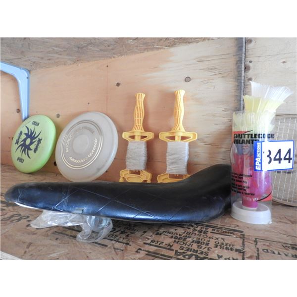 (2) kite strings, (2) frisbees, (8) badminton birdees, (5) badminton raquets, bike seat