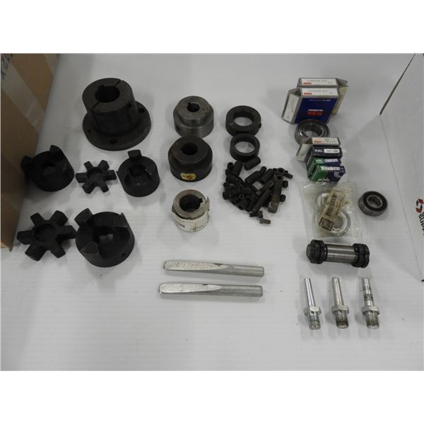 (4) Sprocket hubs (unused), (3) Bushing with rubber space (unused), assorted set screws (unused), (9