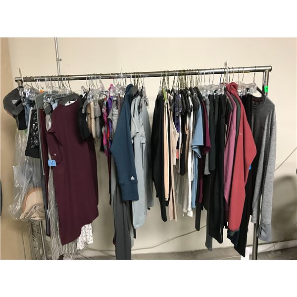 RACK OF ASSORTED SIZED CLOTHING (MANY NEW WITH TAGS) BRANDS INCLUDE; COLUMBIA, LULU LEMON, TNA AN...