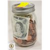 MASON JAR OF PENNIES AND CANADIAN DOLLAR BILL