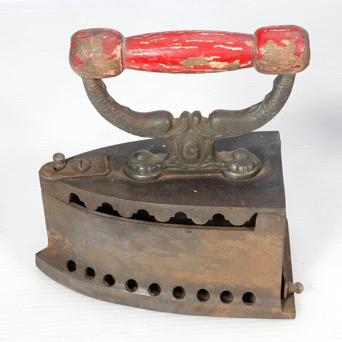 Two antique coal/charcoal irons and an antique kerosene iron