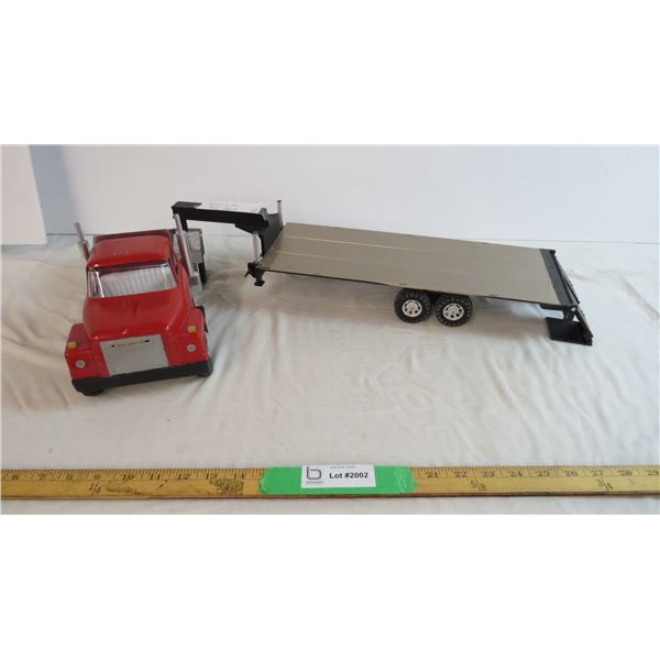 International truck with custom flat deck trailer - 34" total length