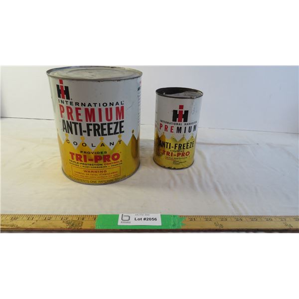 (2) IH oil tins 1 large 1 small