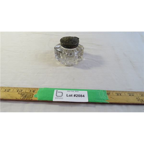 Glass container with silver lid