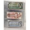 Image 2 : Binder of 6 Canadian bills 1967 $1, 1986 $2, 1954 $5, 1971 $10, 1954 $20, 1988 $50