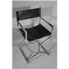 Image 1 : A Chrome and Black Leather Folding Chair.
