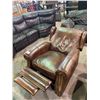 Image 1 : LEATHER RECLINING CHAIR IN NEED OF REPAIRS