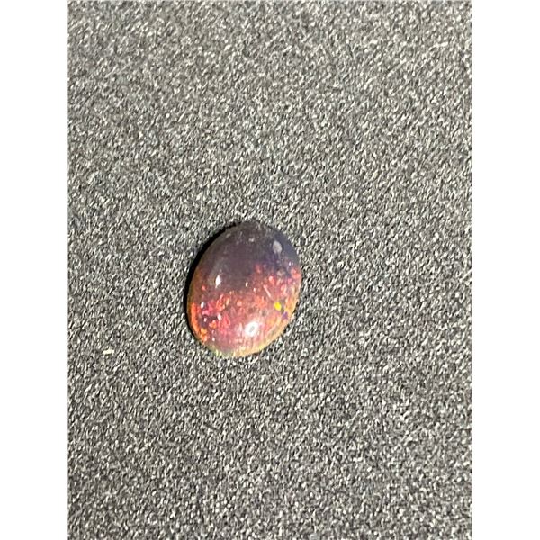 BLACK OPAL 1.355CT, 11.72 X 8.33 X 3.00MM, OVAL CABOCHON, PLAY OF COLOUR, ETHIOPIA