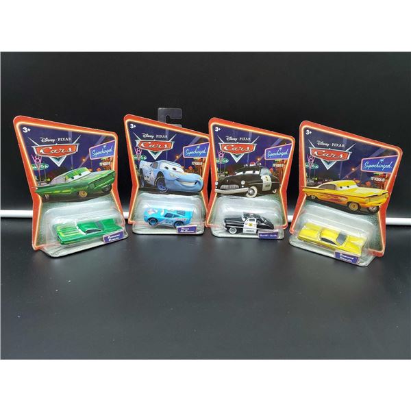 Lot of 4 Assorted Disney Cars collectibles packaged