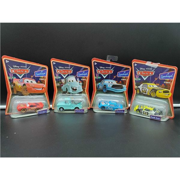 Lot of 4 Assorted Disney Cars collectibles packaged
