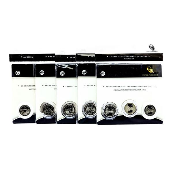 Lot of (5) 2011 America The Beautiful Three-Coin Quarter Sets