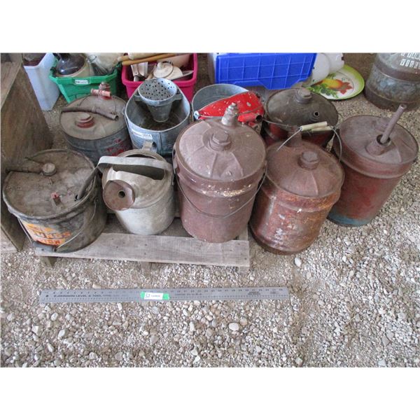 Pallet with gas can, watering cans, hastings piston ring pail, (9 total)