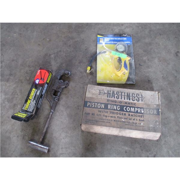 inflator with gauge, pipe cutter, tubing bender