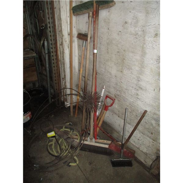 lot of brooms, tow rope, misc
