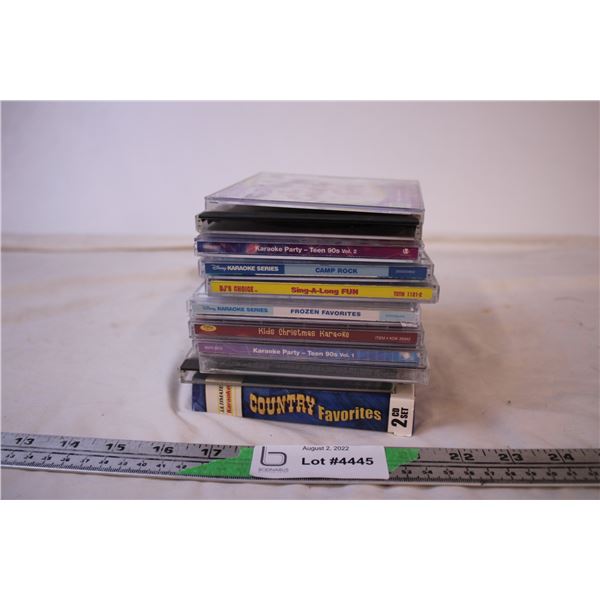 (7) Assorted Karaoke CD’s + Cleaning CD’s