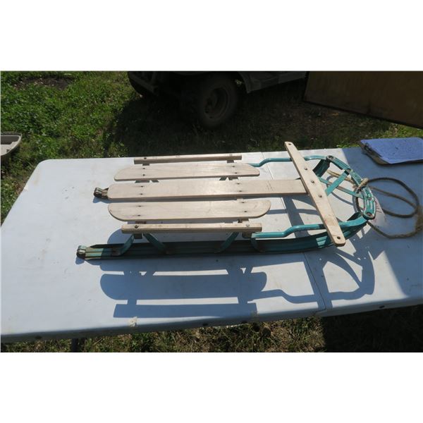 antique kids sled, green.