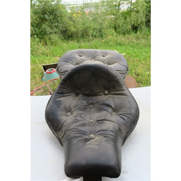 black softtail wide double motorcycle seat.
