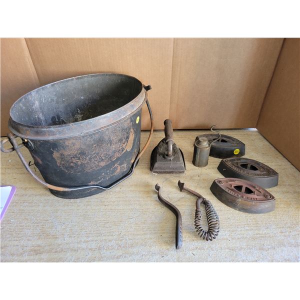 Metal pail - 4 sad irons, 1 trivet, oiler, stove top lifter and handle