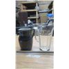 Image 1 : 2- pitchers.  1-black ceramic,  large glass pitcher.