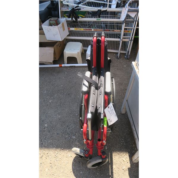 Red & black wheelchair.