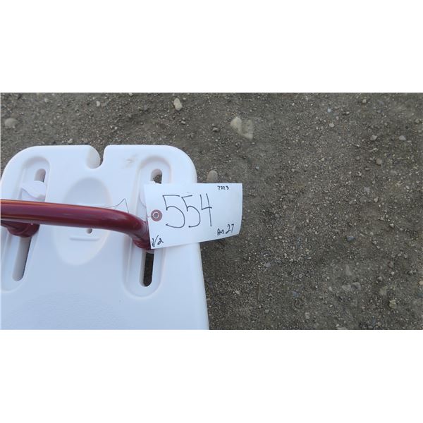 white shower seat, potty with handles.