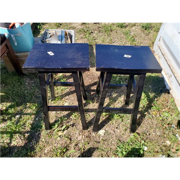 2 brown wooden stools