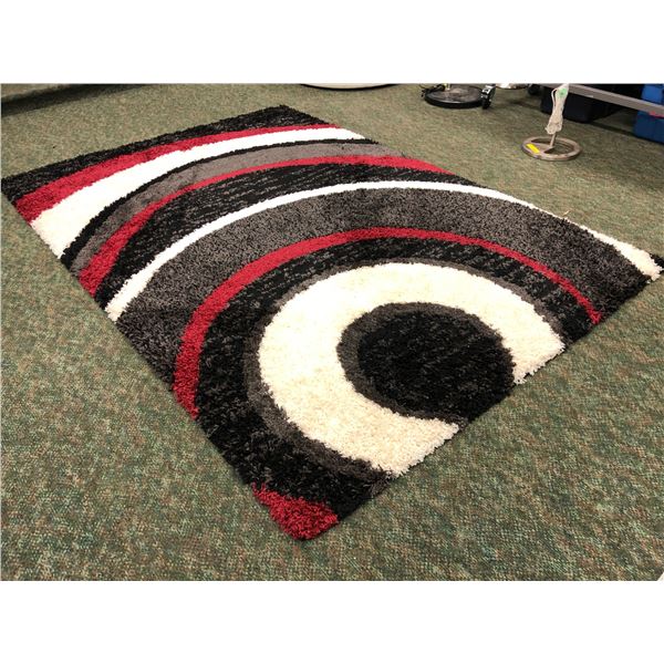 Multi coloured shag area rug - Approx 5ft x 8ft (From the superhero show)