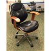 Image 1 : Contemporary black leather office chair (From the superhero show)