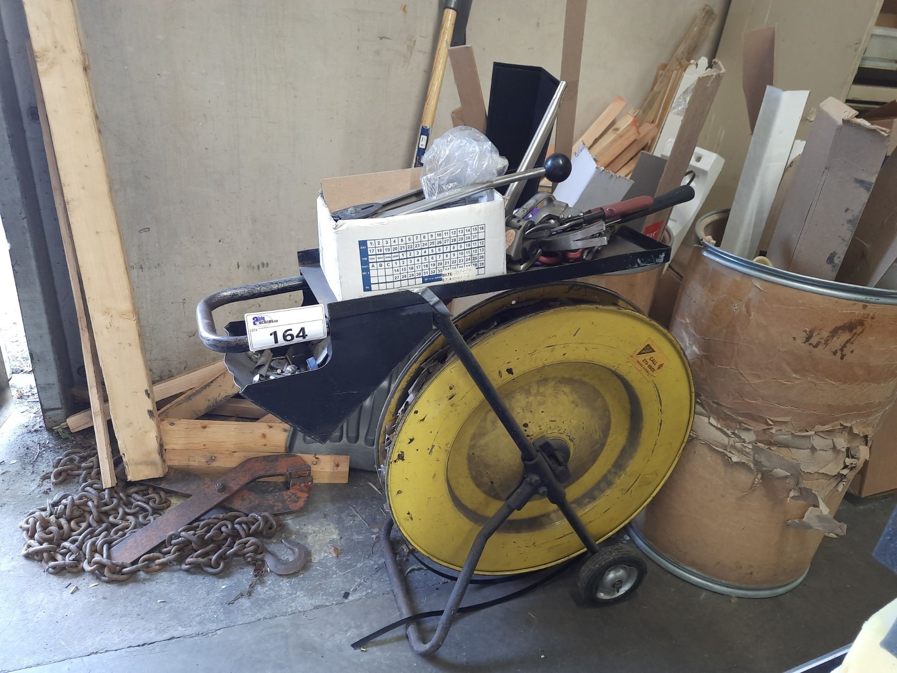 YELLOW MOBILE INDUSTRIAL BANDING MACHINE WITH TOOLING