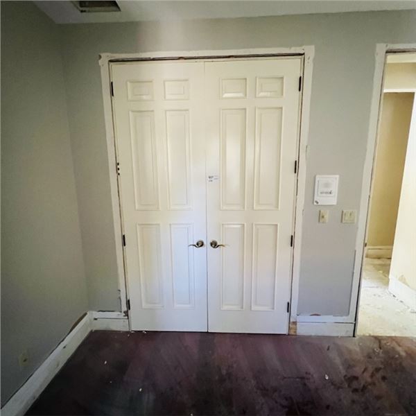 SOLID WOOD  DOUBLE DOOR WITH FRAME DOOR APPROX 61.25" X 95." SEE PHOTOS ITEMS WILL BE REMOVED AND RE