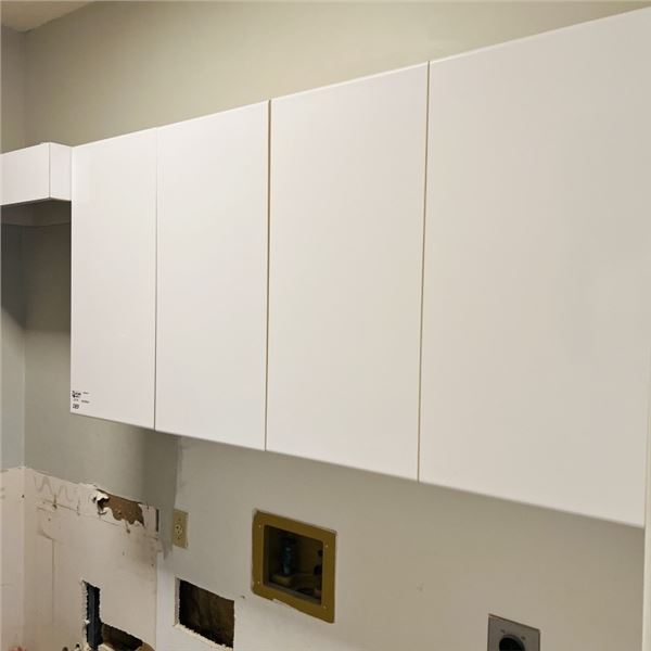 LAUNDRY ROOM CABINETS WITH CLOTHING HANGER 63" X 29" PLUS HANGER 33.75" SEE PHOTOS
