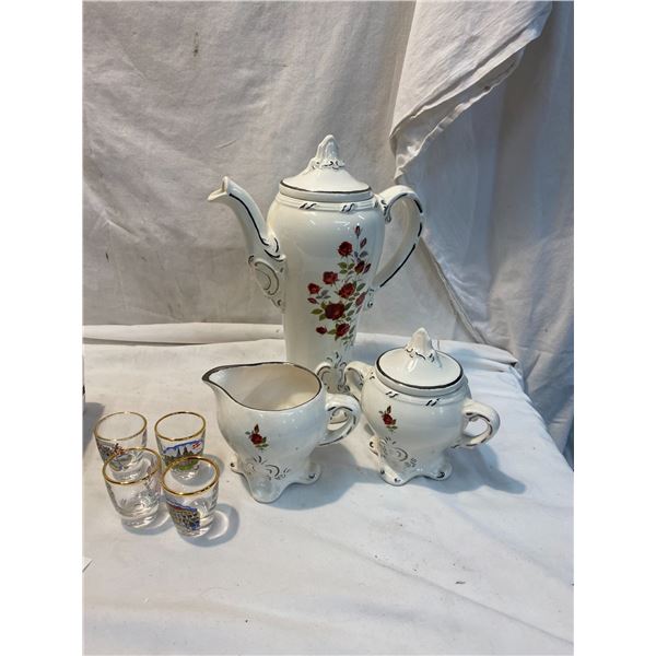 Creamer, sugar, and coffee pot and shooter glasses