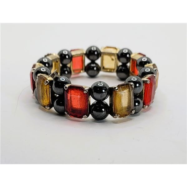 9)  BLACK HEMATITE AND RED AND CARMEL COLORED