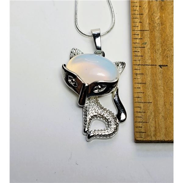 24)  TIBETAN SILVER AND OPALINE FOX PENDANT ON