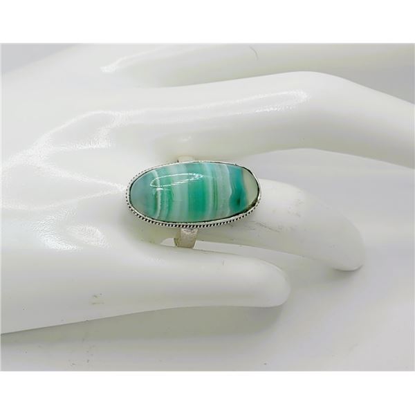 25)  ELONGATED OVAL BANDED GREEN ONYX RING,