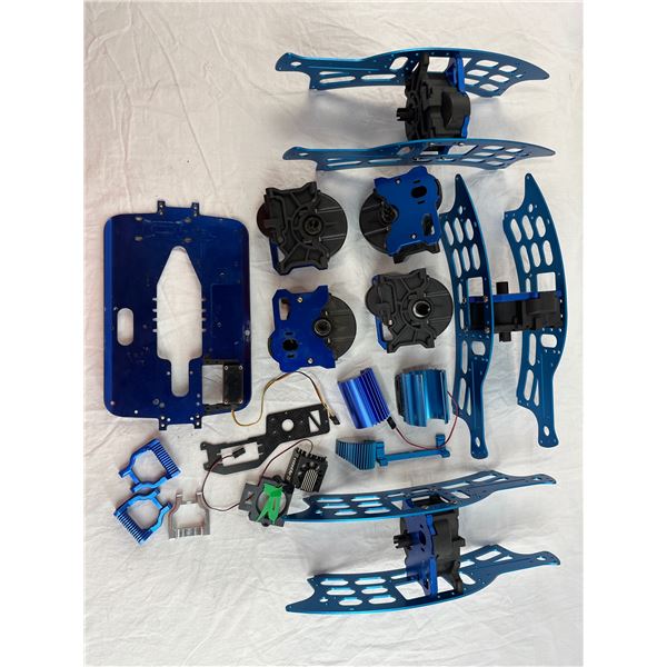 RC Car parts and chassis pieces in blue