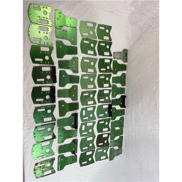 Lot of green aluminum skid plates and chassis parts