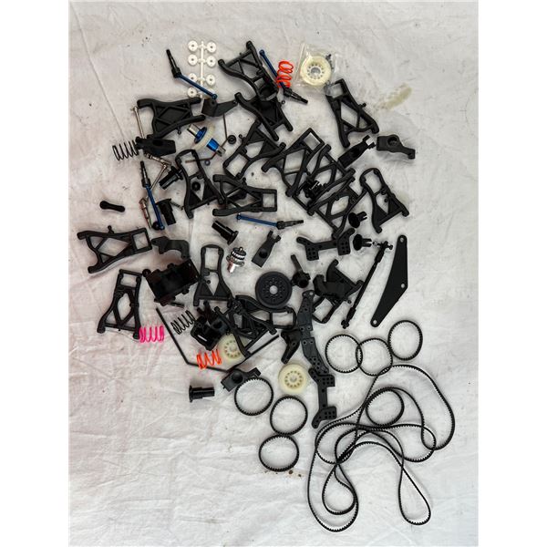 Parts lot with belts, suspension arms and misc